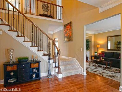 Entry. Step inside into a gracious hall flanked by an office and formal living room.
