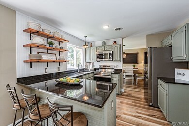 Kitchen with granite countertops, new flooring, an