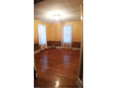 Spacious formal DR with warm hardwood flooring. A 