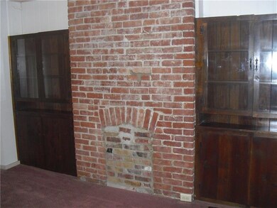 In the dinning room there is the original fireplac