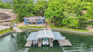 Large property with 155' stone seawall. Three well