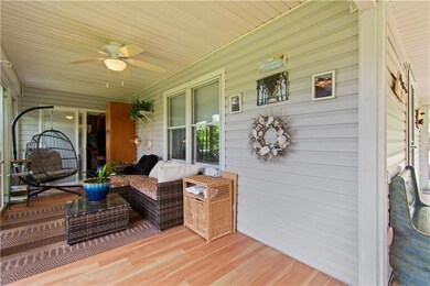 Wooden porch with ceiling fan