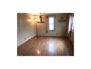 Living Room has shiny laminate (Pergo) Flooring (2002), easy care Vinyl windows (1999), Ceiling fan/light, all Trim molding on first floor replaced with Oak in 1998.