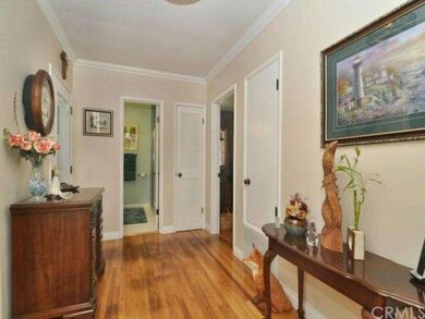 Spacious foyer with beautiful floors and crown mol