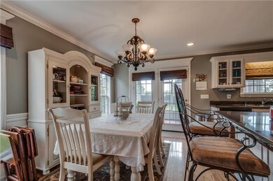 Dining Room With Door That Leads Out To Screened Porch