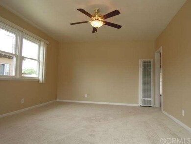 Living room has new carpet and fresh paint.