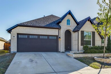 French provincial home with an attached garage, a 