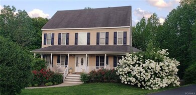 View of the home when the trees and landscaping ar