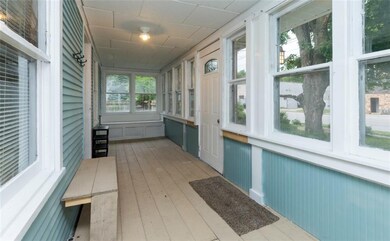 Enclosed Sun Porch with Window Box Sitting Area on