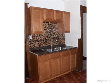 Kitchen lower kitchen with tile backsplash