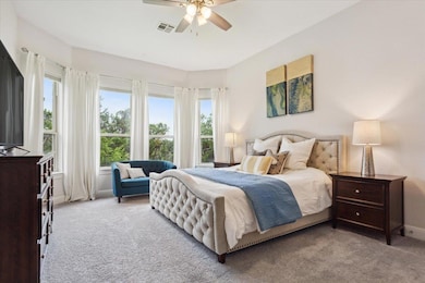 Bedroom with carpet flooring and ceiling fan