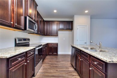 Kitchen with appliances with stainless steel finis