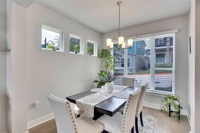 Dining area featuring an inviting chandelier, bas