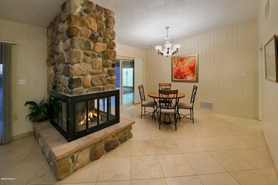 3-Sided Rock Fireplace & Dining Room