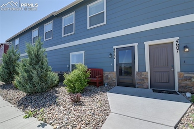 View of exterior entry featuring stone siding