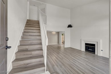 Staircase featuring a notable chandelier, wood fin