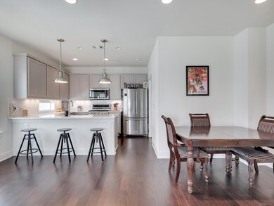 Dining room with recessed lighting, dark wood-sty