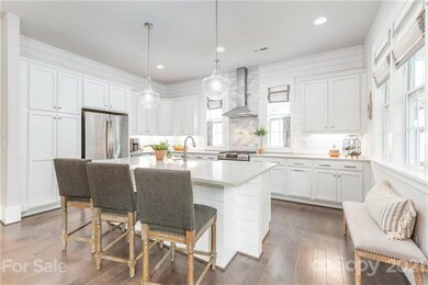 Large gourmet chef's kitchen with gas stove, ship-