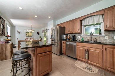KITCHEN WITH OPEN CONCEPT TO DINING AREA AND ADJAC