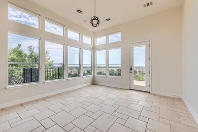 Unfurnished sunroom with baseboards and visible v