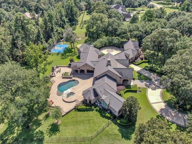 View of pool and spa, covered patio, outdoor kitch