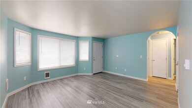 Front door, living area, and hallway.
