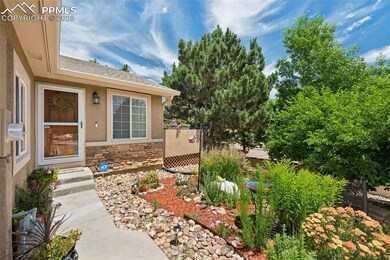 Entrance to property featuring stone siding and stucco siding