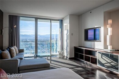 Living area featuring floor to ceiling windows and