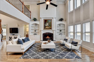 Living room featuring crown molding, dark wood-typ
