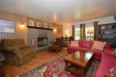 Cozy Family Room with laminate wood flooring and g