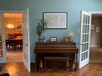 Double French doors lead from tile foyer into the