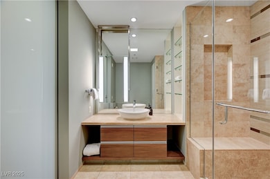 Bathroom with vanity, tile patterned flooring, and