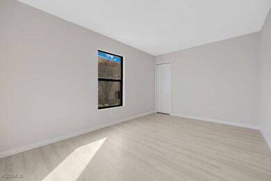 Unfurnished room with light wood-style flooring an