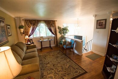 Living room with hardwood overlooking the light fi