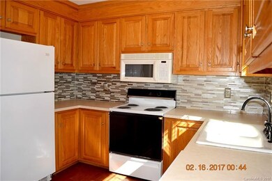 Kitchen has newer appliances and a decorative back