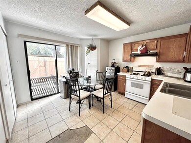 Kitchen featuring white range with gas stovetop, 