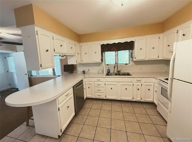 Kitchen boasts counter space & storage.