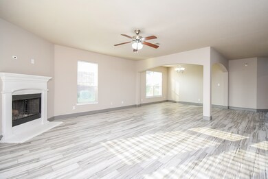 This spacious living area features elegant wood-st