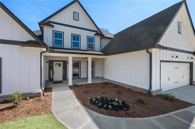Modern farmhouse style home with roof with shingle