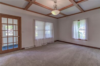 SPACIOUS LIVING ROOM ACCESS FROM THE COVERED PORCH
