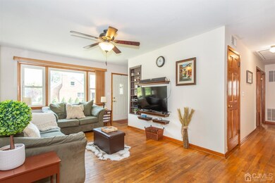 LIVING ROOM FACING FRONT DOOR AND HALLWAY TO BEDRO