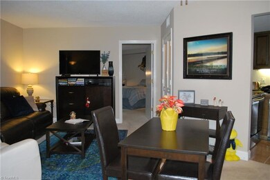 Another view of living room and small eating area.