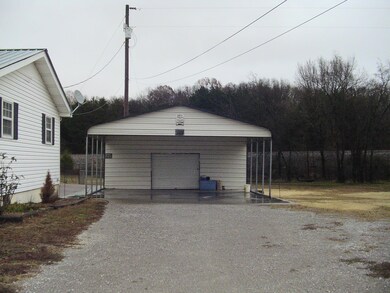 Two car carport with concrete pad