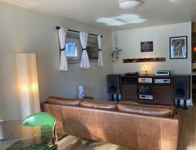 Living room with hardwood / wood-style flooring