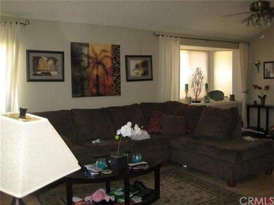 The front door opens into a spacious living area. 