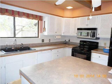 All appliances stay - includes a trash compactor