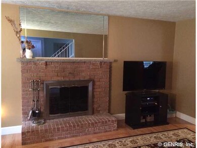 Living Room Wood burning fireplace with brick surr