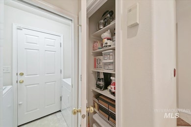 Storage area featuring washer and dryer
