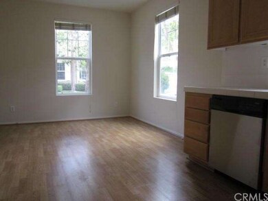 Dining area with laminate flooring and new paint.