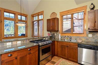 Modern kitchen with stainless steel appliances, gr